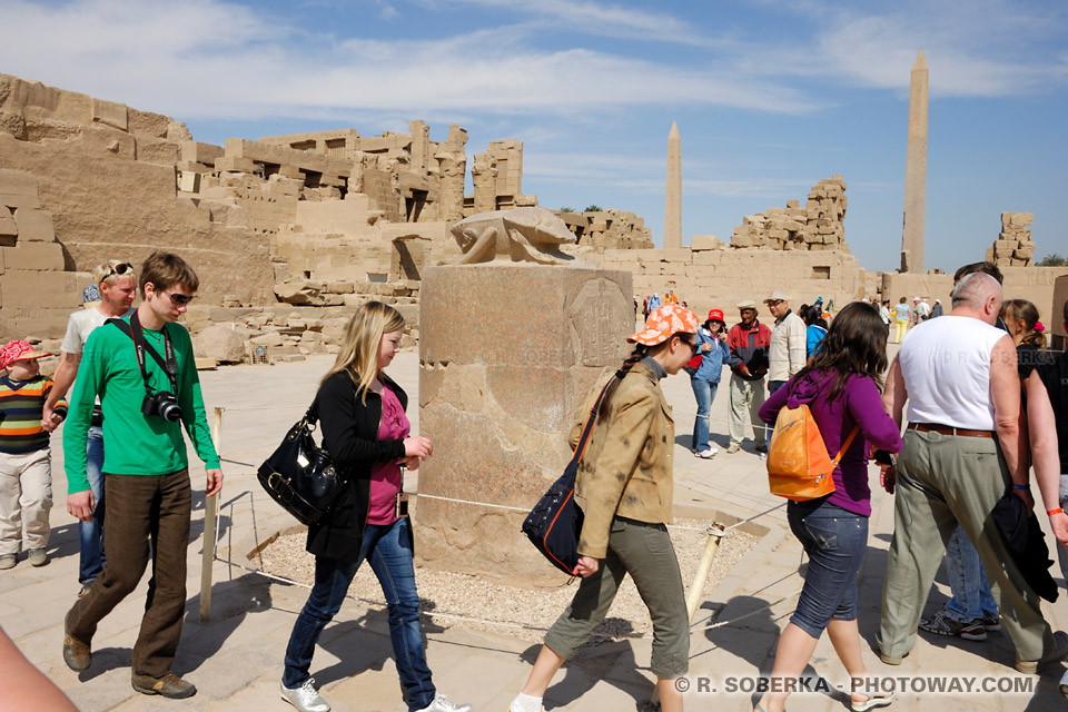 Tourists walking around the sacred scarab Tourists walking around the sacred scarab